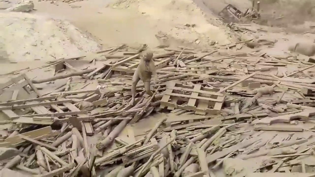 Woman Escapes From Fast-Moving Floodwaters in Peru