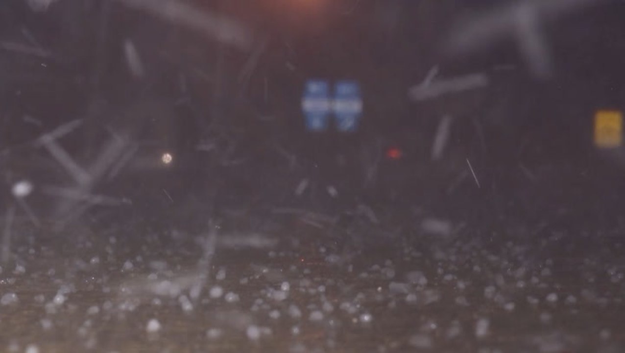 Massive hail burst covers highway
