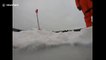 GoPro footage shows camera plunge through half a metre of ice into Canadian lake