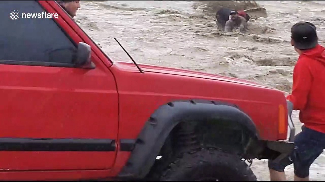 Heroic moment man rescues two others from a flash flood in California