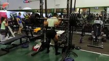 Guy Fails to Balance Weights on Rod While Trying to do Squats in Gym