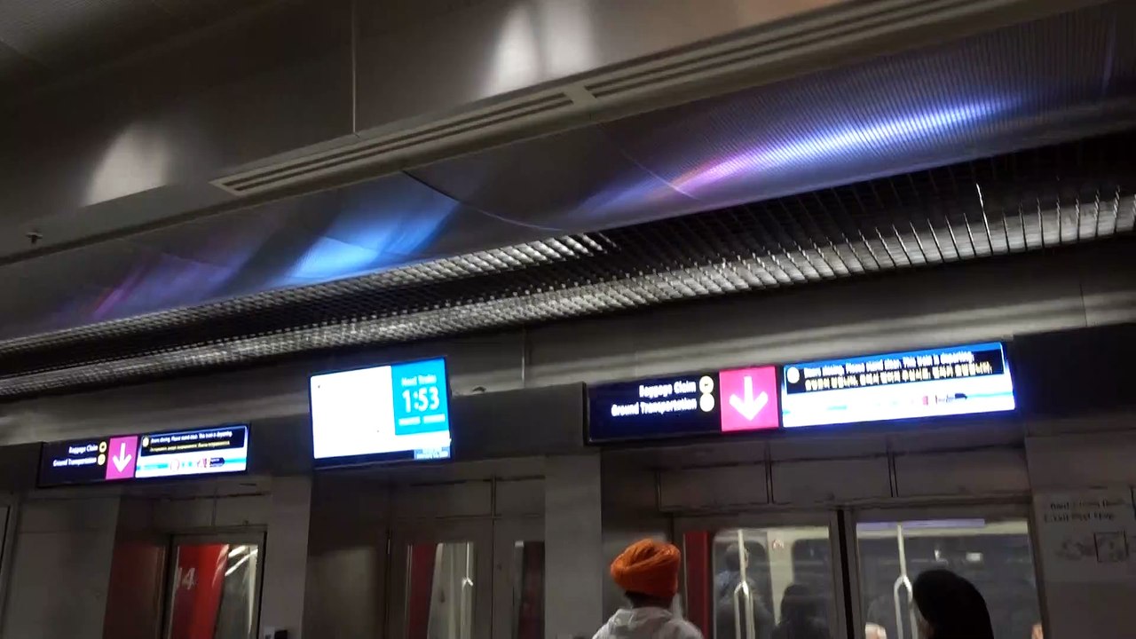 BDMV-110 Aruna & Hari Sharma at Seattle WA Airport for train to Baggage Reclaim Fb 11, 2020