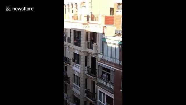 Coronavirus: Light-hearted moment locked-down Madrid neighbours hit tennis ball across street