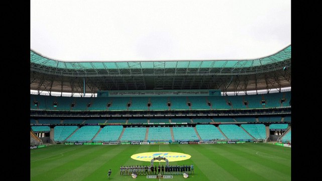 Brazilian team wear masks in protest at having to play