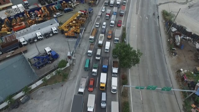 Long queues at coronavirus checkpoints as Philippine capital Manila starts month-long lockdown