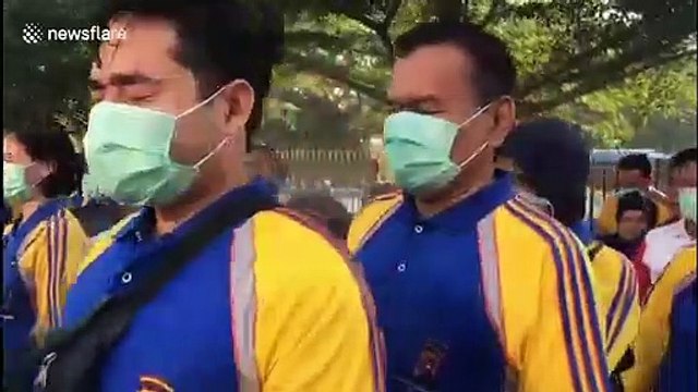 Police force in Indonesia sprayed with disinfectant to prevent COVID-19 spread