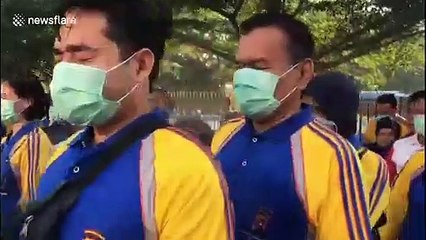 Police force in Indonesia sprayed with disinfectant to prevent COVID-19 spread