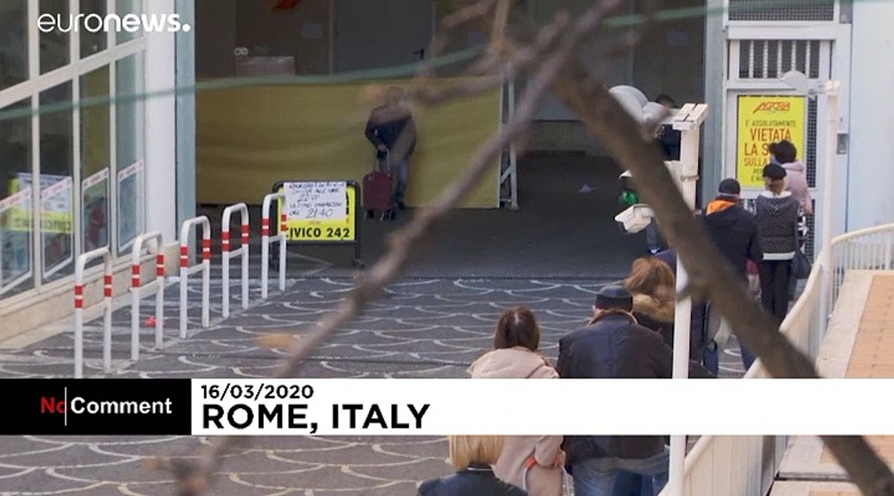Coronavirus: Italians comply with social distancing rules outside supermarket