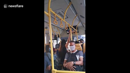 Soldiers board bus to check documents during lockdown in Manila