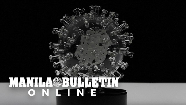 British artist creates coronavirus glass sculpture