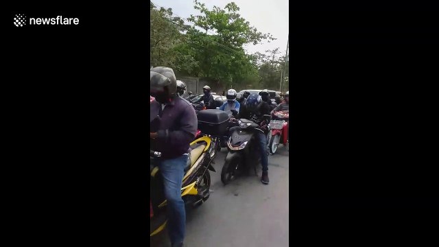 Long queues of vehicles at coronavirus military checkpoint in the Philippines