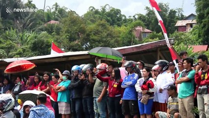 Indonesian locals participate in traditional 'pig catching' contest