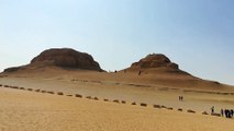 Italian Tourists Climbing El Modawara Mountain In Egypt