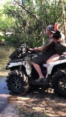 Girl Takes a Dive into Muddy River