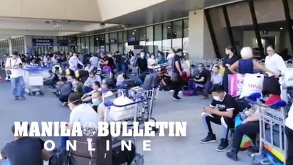 Passengers flock outside the NAIA Terminal 1 on Thursday