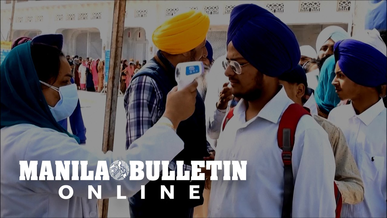 Temperature checks and hand sanitizer at India's Golden Temple