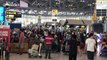 Chaos at Bangkok airport as tourists scramble to return home amid soaring coronavirus cases