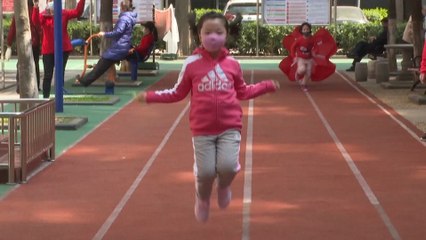 China’s community life cautiously returns to normal as new coronavirus cases drop