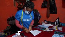 Coronavirus: Young Liberians make African print masks for protection