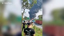 Oil tank drops from truck after collision causing huge fire on Chinese highway