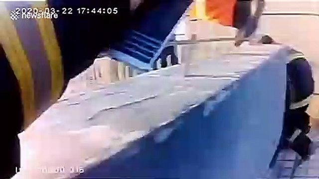 Chinese firefighters rescue alleged suicidal woman hanging from 32nd-floor balcony