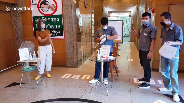 Office workers screened for COVID-19 in Bangkok as country declares 'state of emergency'