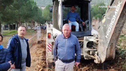 Denizli'de profesör, BİYOM Merkezi arazisindeki çalışmayı durdurmak için kepçenin önüne yattı