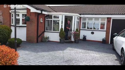 This is what social distancing looks like: UK mailman delivers letter into FISHING NET