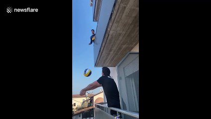 Quarantined volleyball pros play from balconies in locked down Italy