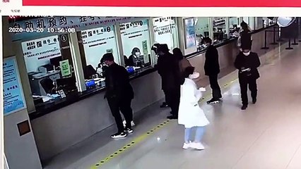 Kind-hearted Chinese man sprints away after throwing a bag of cash worth £12,000 onto hospital counter