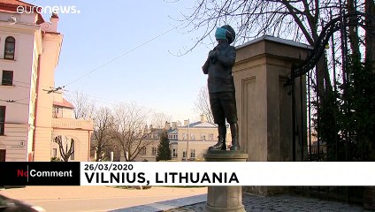 Coronavirus: masked statues make cultural comment and health reminder in Lithuania