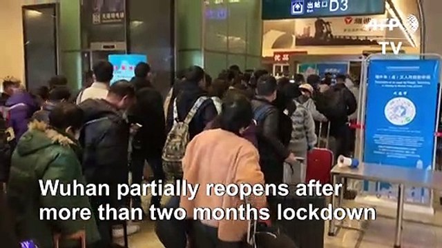Hundreds arrive in Wuhan as China eases lockdown restrictions