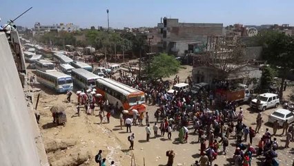 Yeni Delhi'de Kovid-19 tedbirleri nedeniyle çalışanlar köylerine dönüyor - YENİ