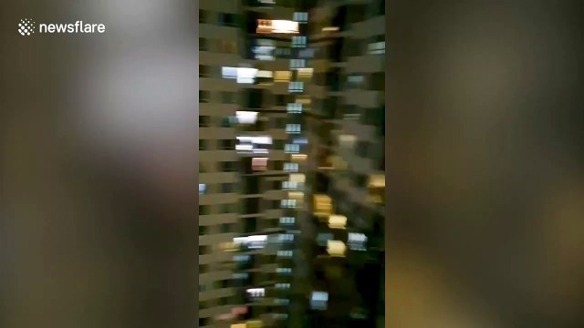 Apartment block residents clap for coronavirus health workers in Thailand