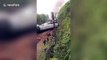 Passenger train in China derails and flips over due to landslide, killing one