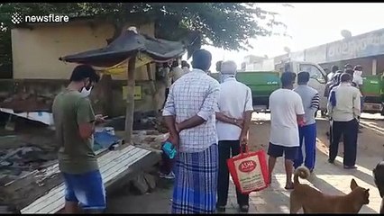 Indian residents queue to buy meat from butcher despite country's lockdown