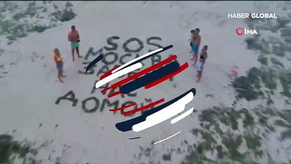 Koronavirüs nedeniyle mahsur kalınca sahile "Bizi eve götür" yazdılar