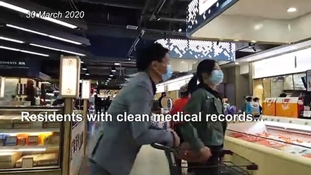 Wuhan residents go shopping as China slowly eases lockdown restrictions