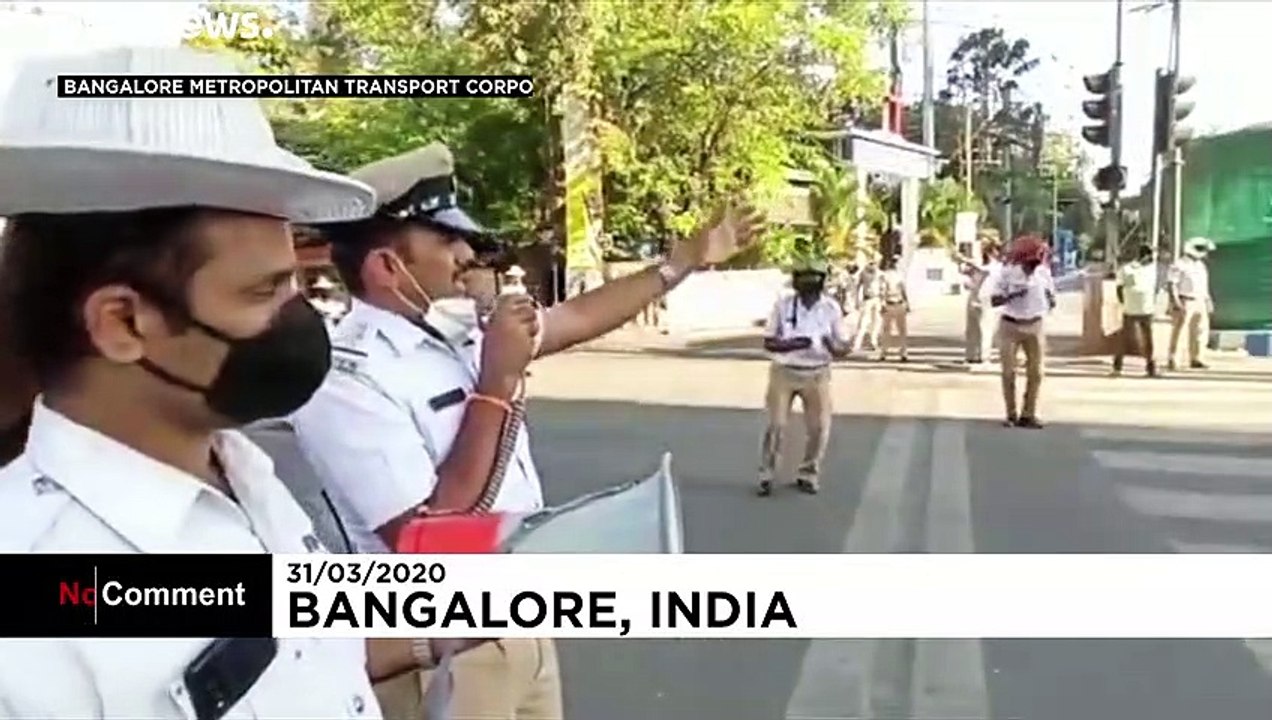 Indian police wear coronavirus helmets to spread lockdown message