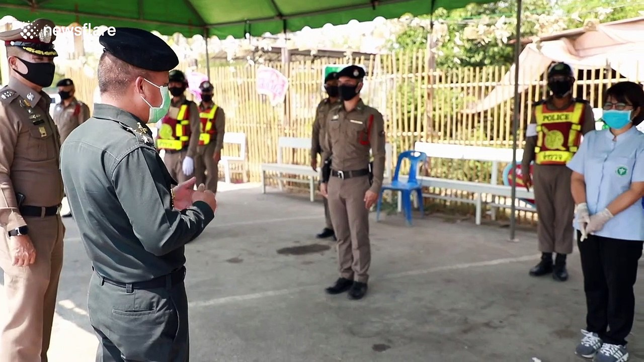 Thai police check temperature of drivers fleeing Bangkok as COVID-19 exodus continues