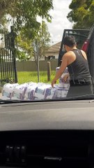 Couple Loads Pallets of Toilet Paper into Van