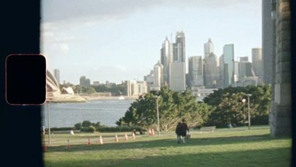 A Couple In A Park Overseeing Sydney City Skyline And The Opera House
