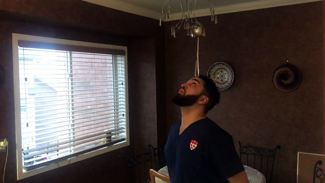 Guy Skillfully Balances Various Objects on His Head