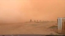 Massive wall of dust sweeps over fields