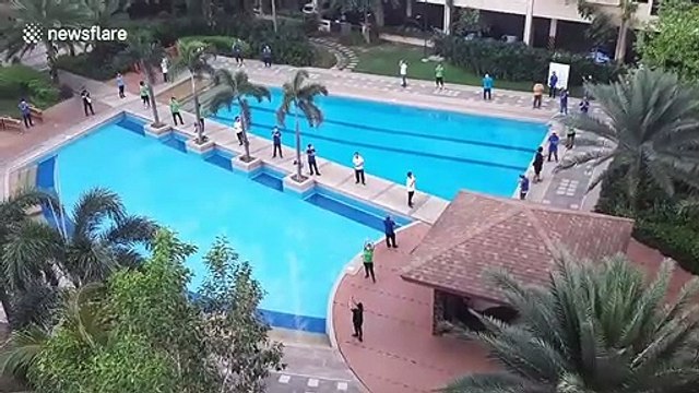 Apartment block residents applaud Covid-19 medical workers in the Philippines