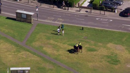Police move people along at London's parks