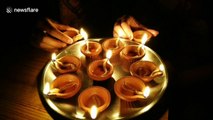 Indians switch off their lights and light candles in show of solidarity in fight against coronavirus