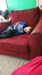 Child Watches Wiggles While Siblings Look On Upset