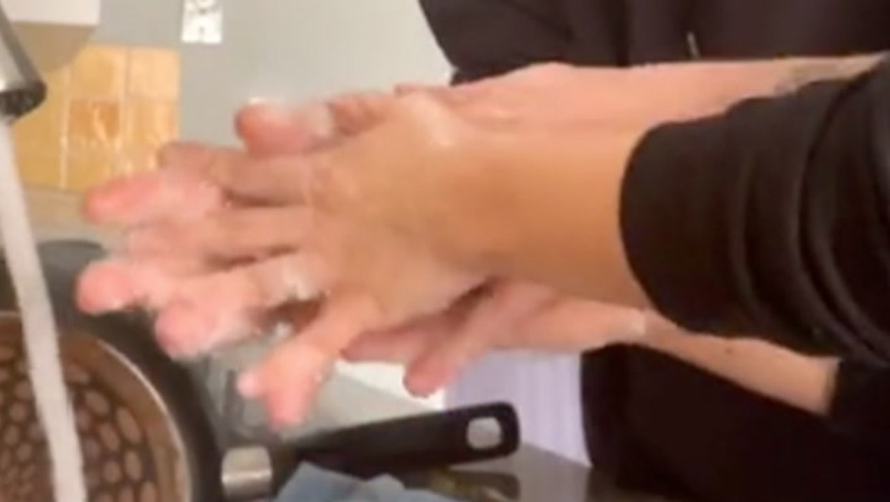 Cute Couple Washes Each Other's Hands