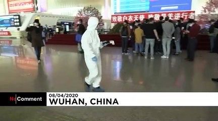 People board trains and planes out of Wuhan for first time in 11 weeks